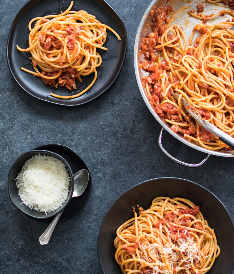 Bucatini all'Amatriciana served on two plates.