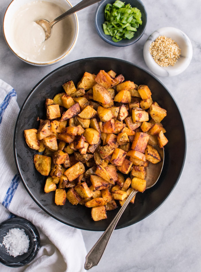 spicy, crispy roasted potatoes in a bowl.