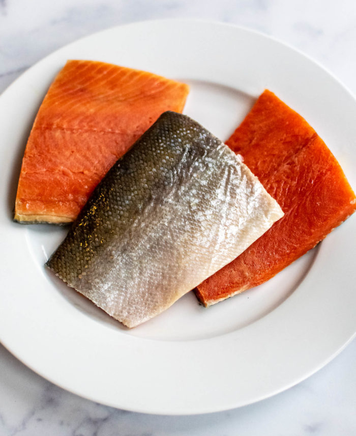 Three pieces of sockeye salmon on a plate