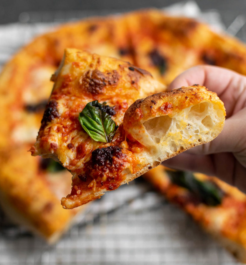 Close up of a slice of the Pizza with 'Nduja and Tomato Cream Sauce.