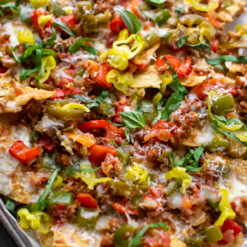 Italian Sausage and Pepper Nachos on a sheet pan.