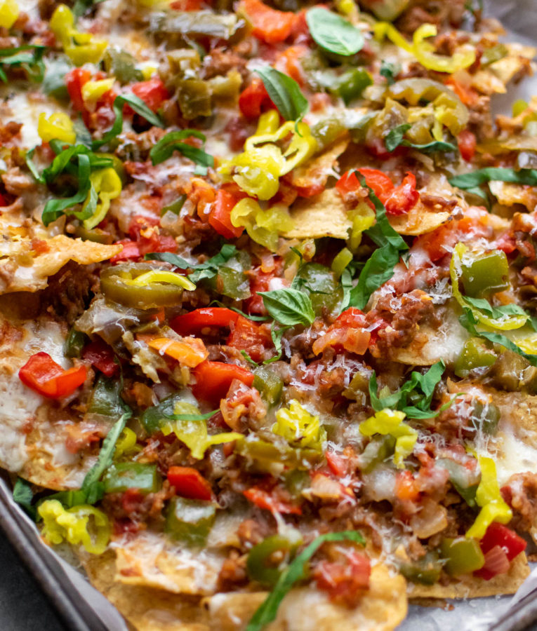 Italian Sausage and Pepper Nachos on a sheet pan.