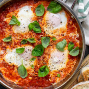 Eggs in Purgatory with White Beans in a pan. Served with toasted bread.