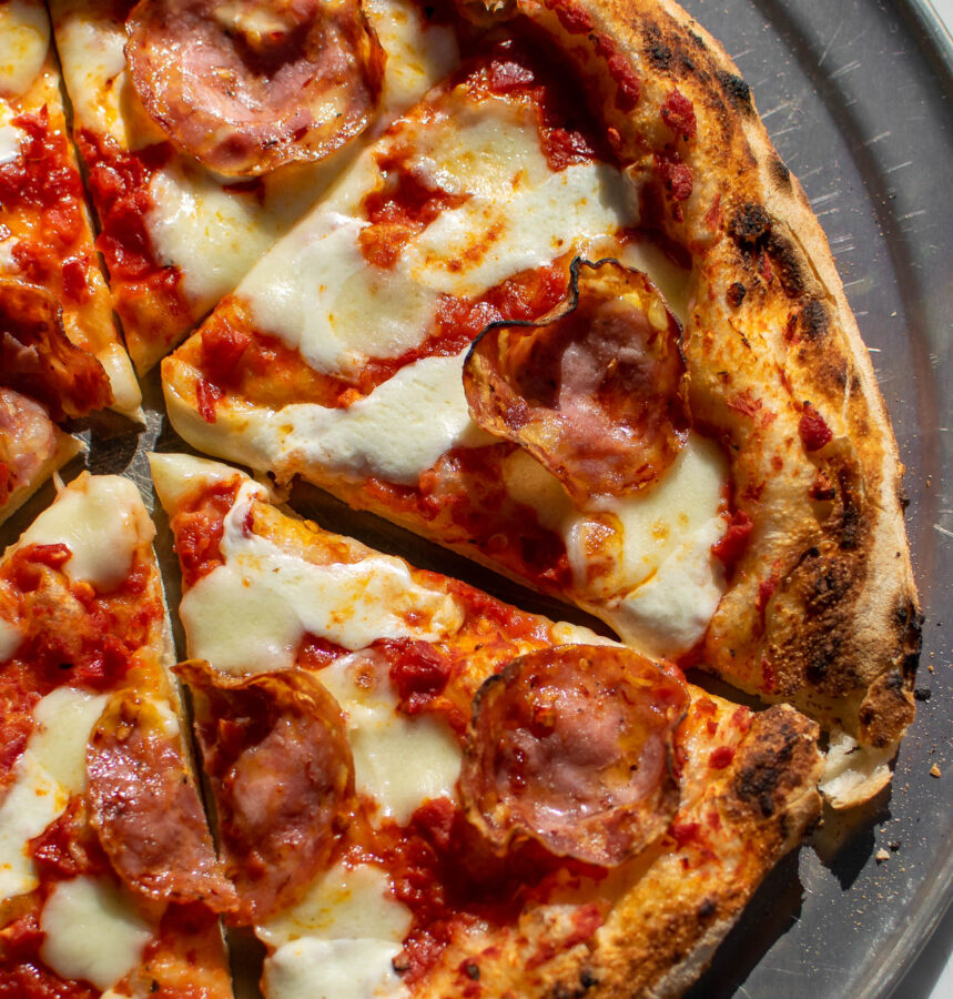 Pizza Diavola with Hot Soppressata close up shot of pizza slice.