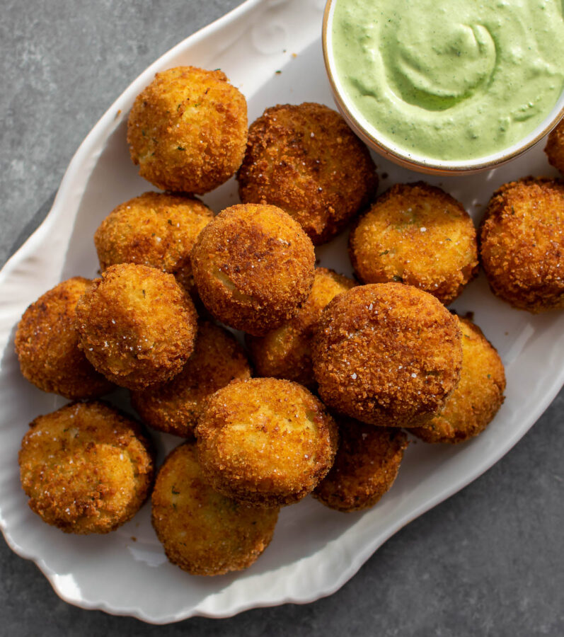 Cheesy Fried Colcannon Balls with dipping sauce.