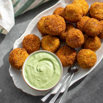 Cheesy Fried Colcannon Balls on a serving platter.