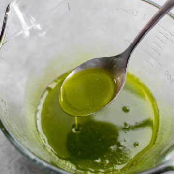 Chive oil in a bowl.