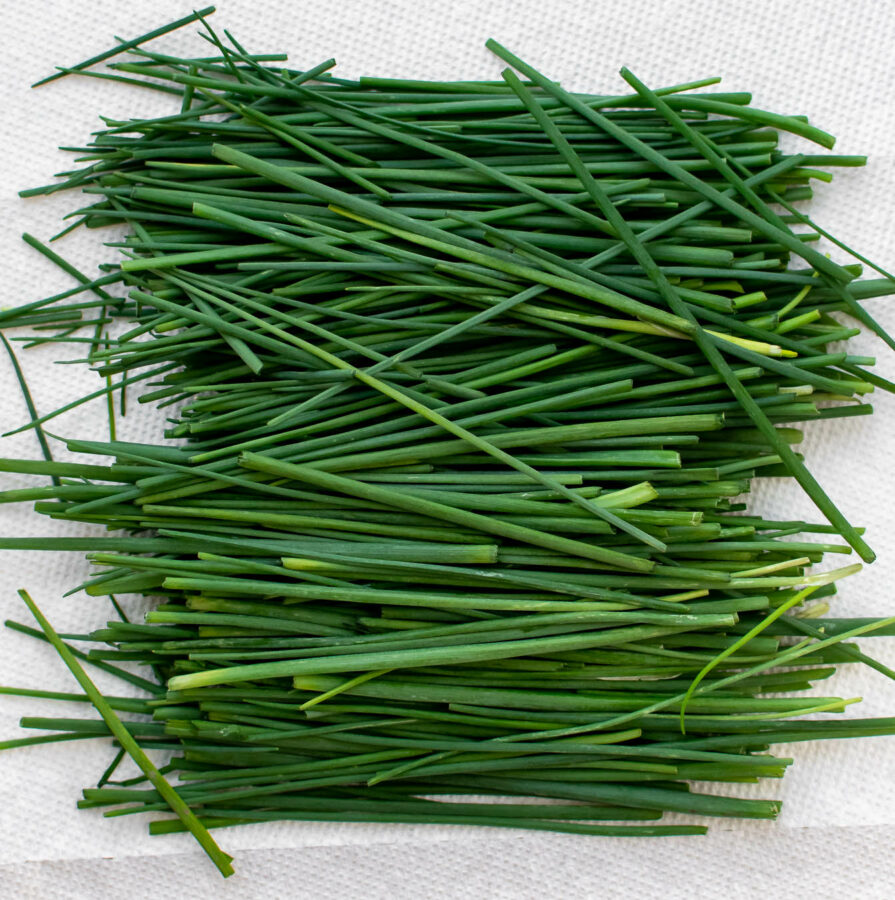 Fresh chives in a pile.