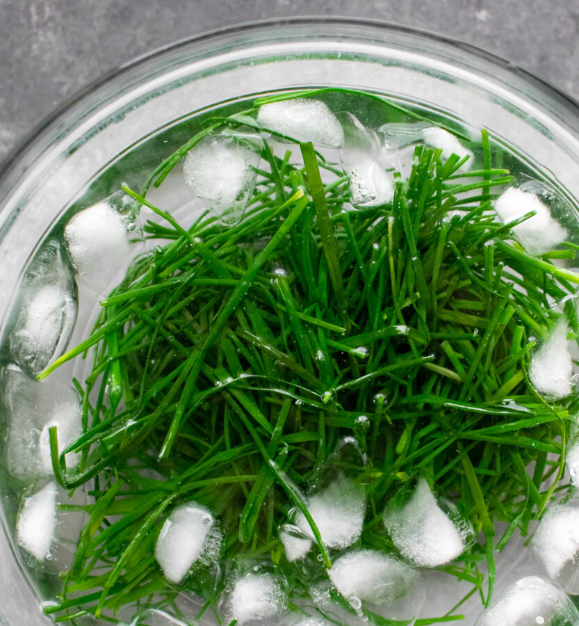 Chives in an ice bath.