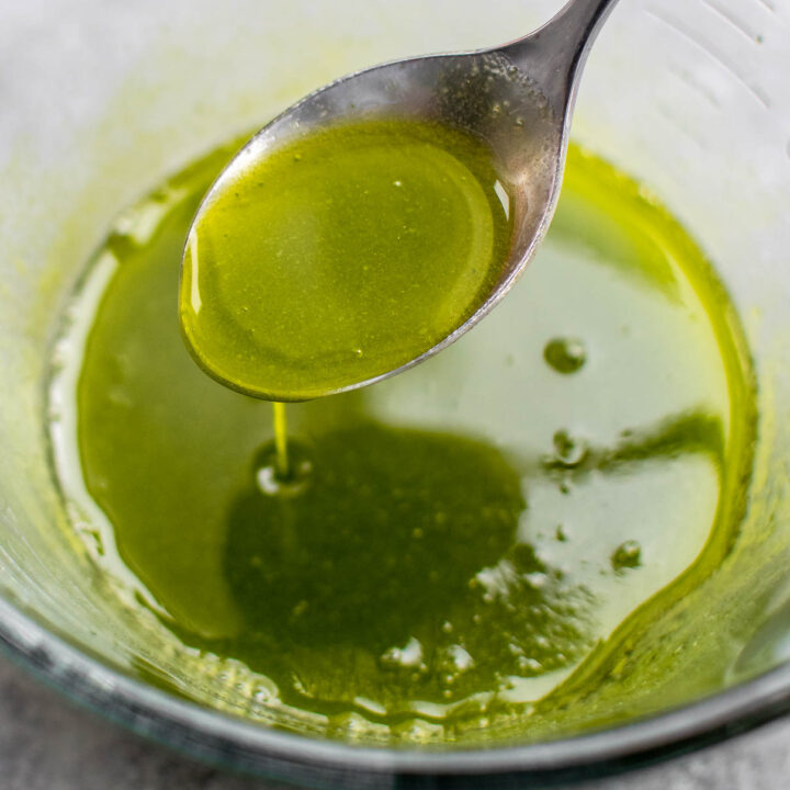 Chive oil in a bowl.