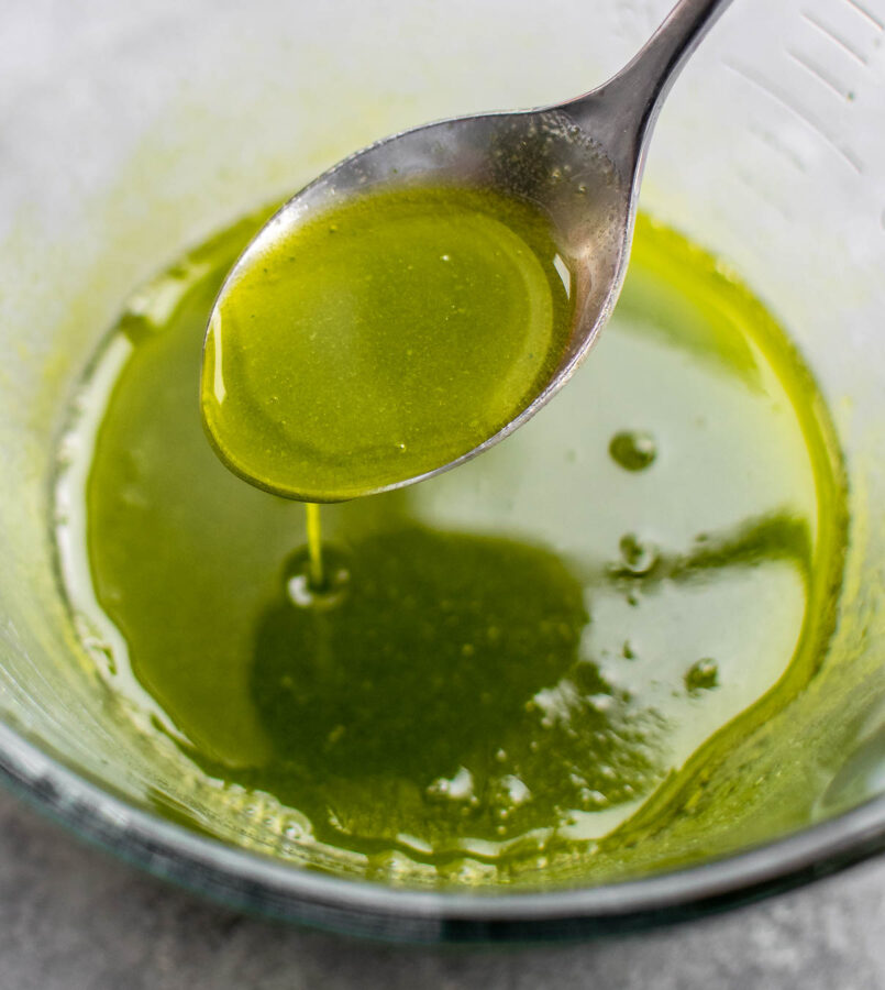 Chive oil in a bowl.