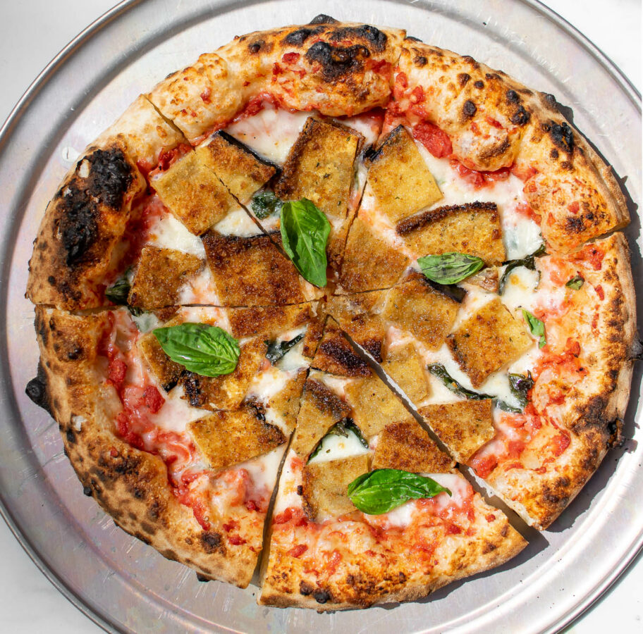 Fried Eggplant Parmesan Pizza on a pizza pan.