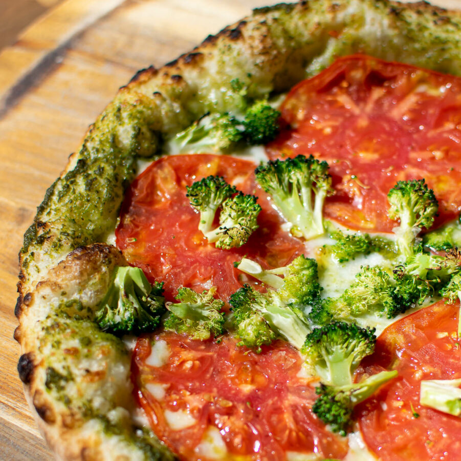 Pesto Pizza with Tomatoes and broccoli.
