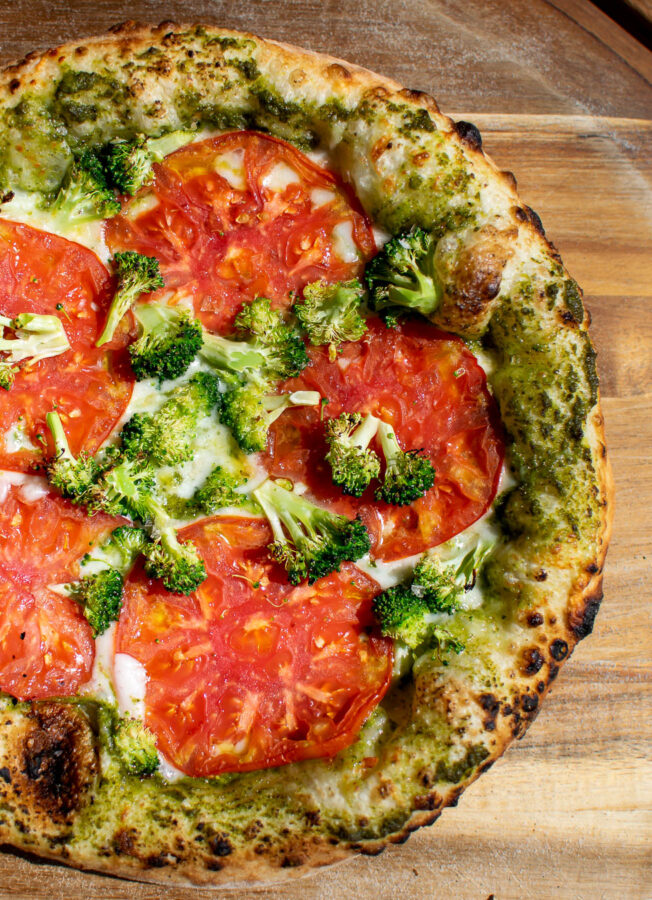 Pesto Pizza with Tomatoes and broccoli.