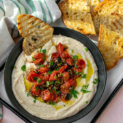 White Bean Dip with Puttanesca served with grilled bread.